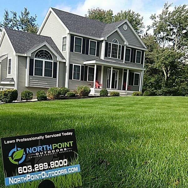 House with beautiful healthy green lawn in New Hampshire